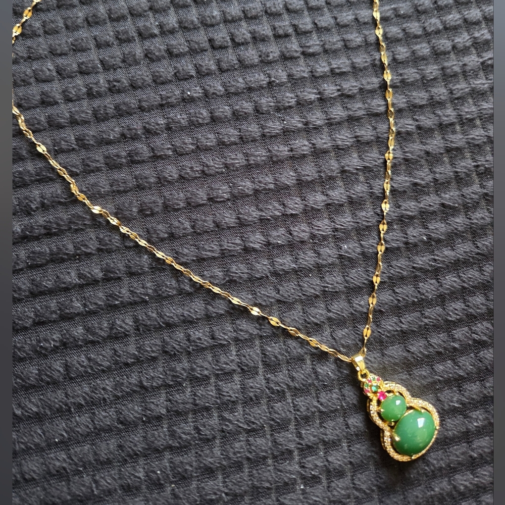 Jadeite, ruby, emerald in a steel necklace.